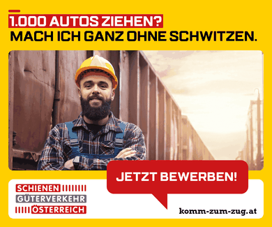 A man with a beard, wearing an orange helmet and plaid shirt, stands confidently in front of train cars. Text in German promotes rail freight careers.